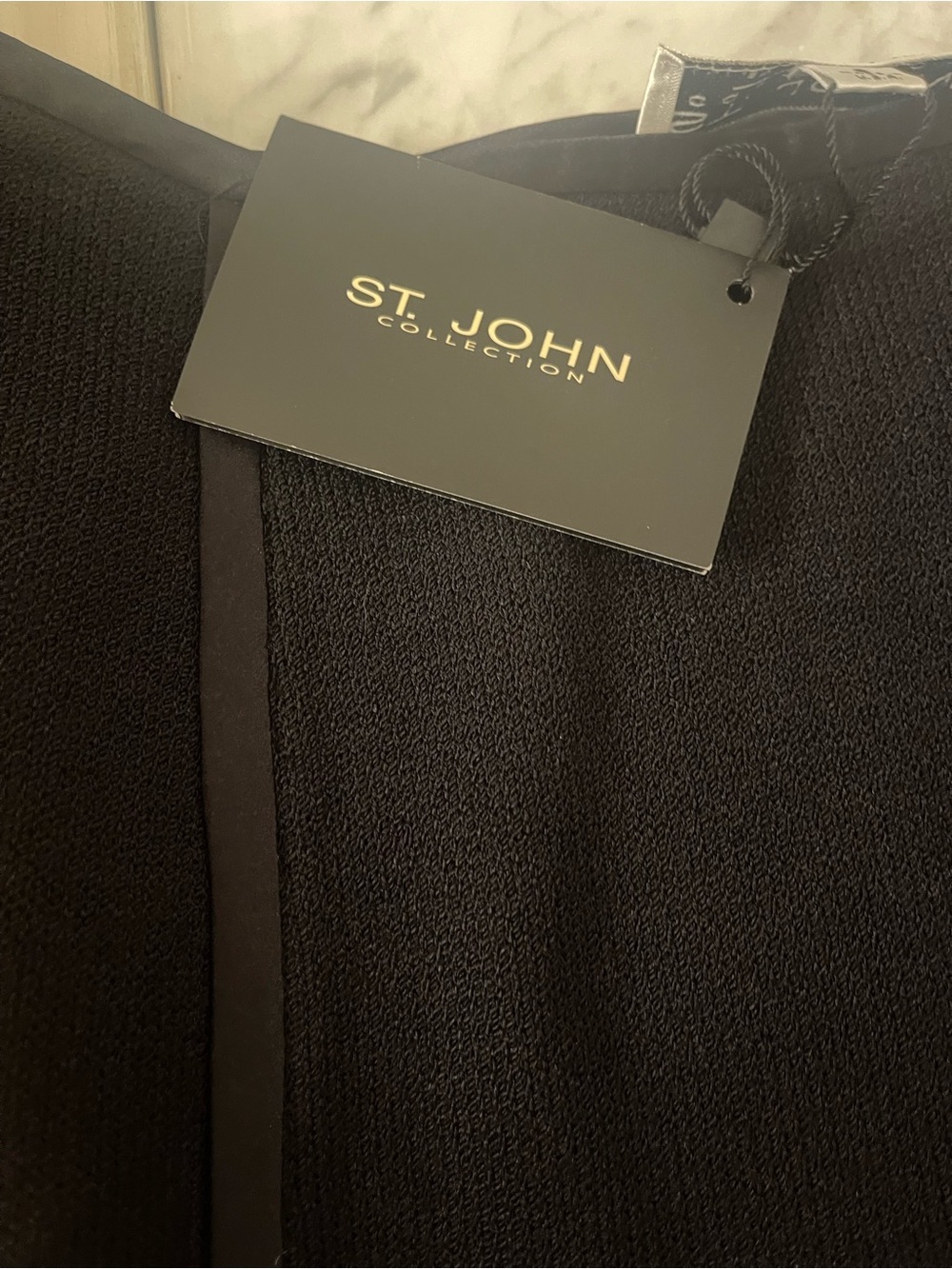 Luxury designer St. John black skirt with slits front and back